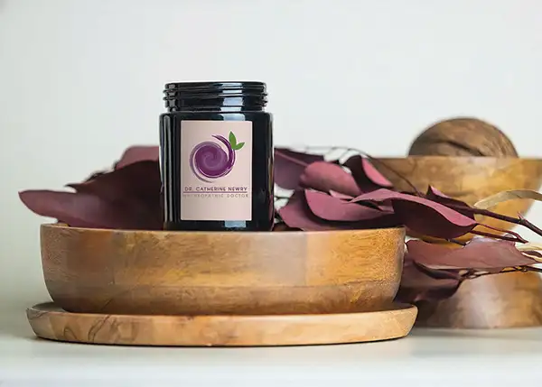 Dr. Catherine Newry "Naturophic Doctor" logo | bottle mockup | designed by Lines and Beyond Creative Design Agency